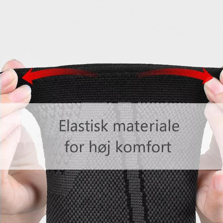 Sort ankelstøtte i elastisk mesh strækkes ud mellem hænder