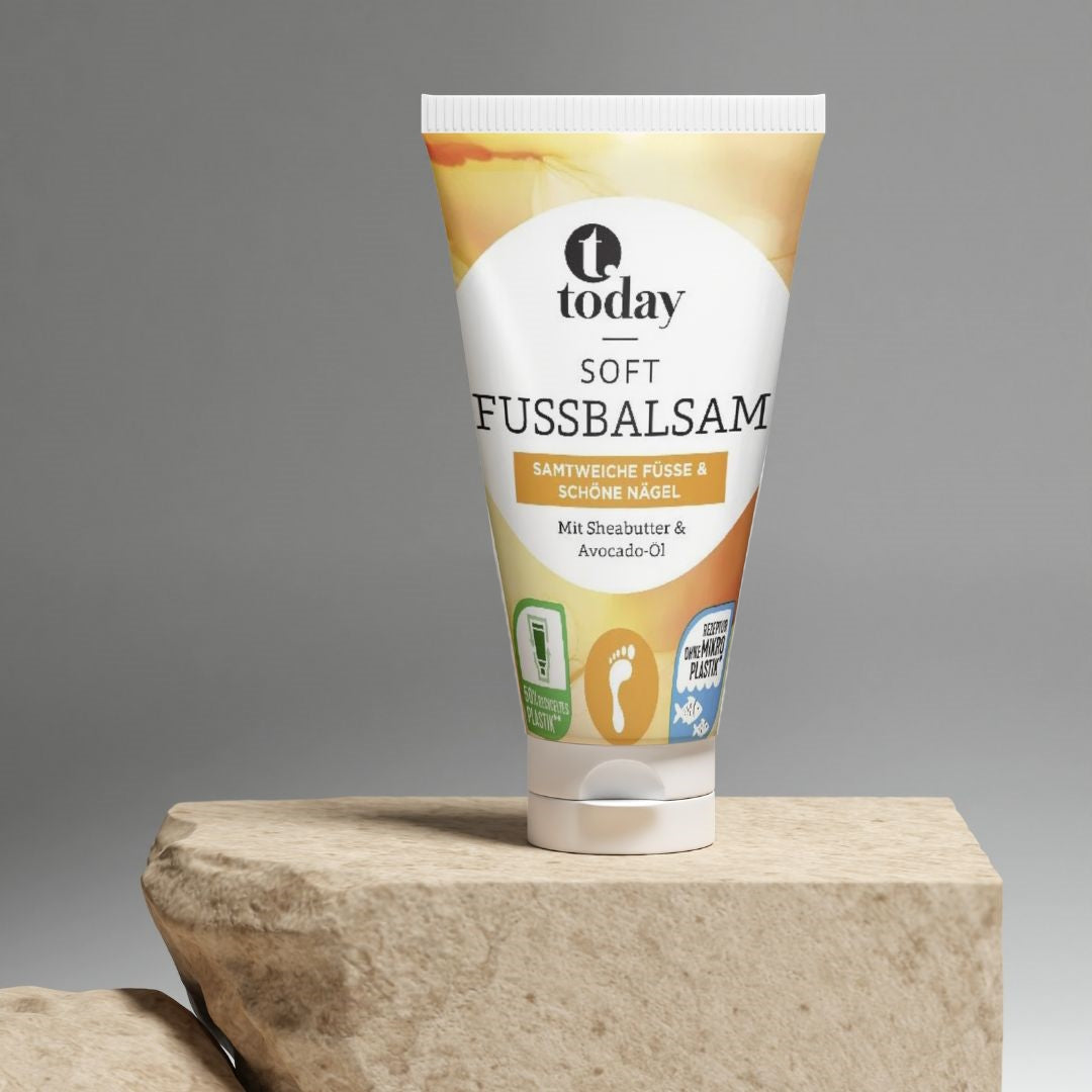 Today Soft Fussbalsam tube med sheasmør og avocadoolie på sten
