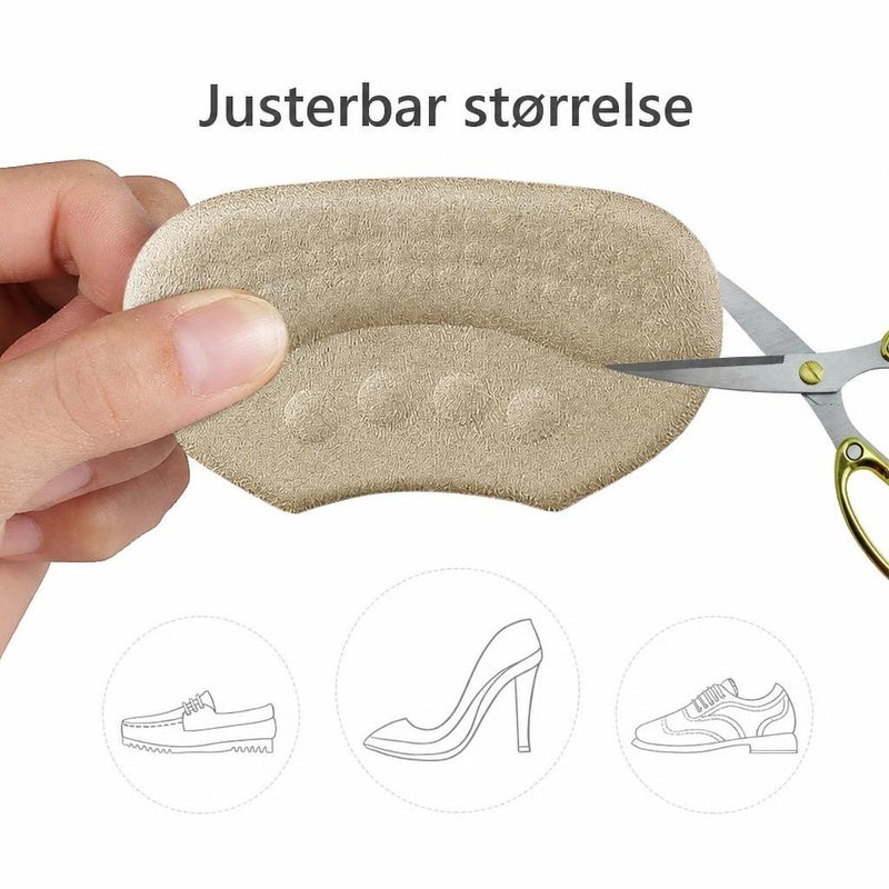 Beige hælindlæg klippes til med saks for justerbar størrelse