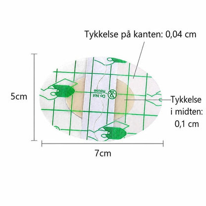Ovalt gennemsigtigt skavsårsplaster med grøn gitterfolie og mål 5 x 7 cm