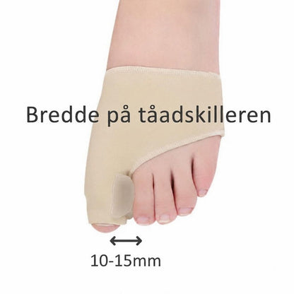 Beige hallux valgus-støtte med tåseparator på fod, bredde 10-15 mm