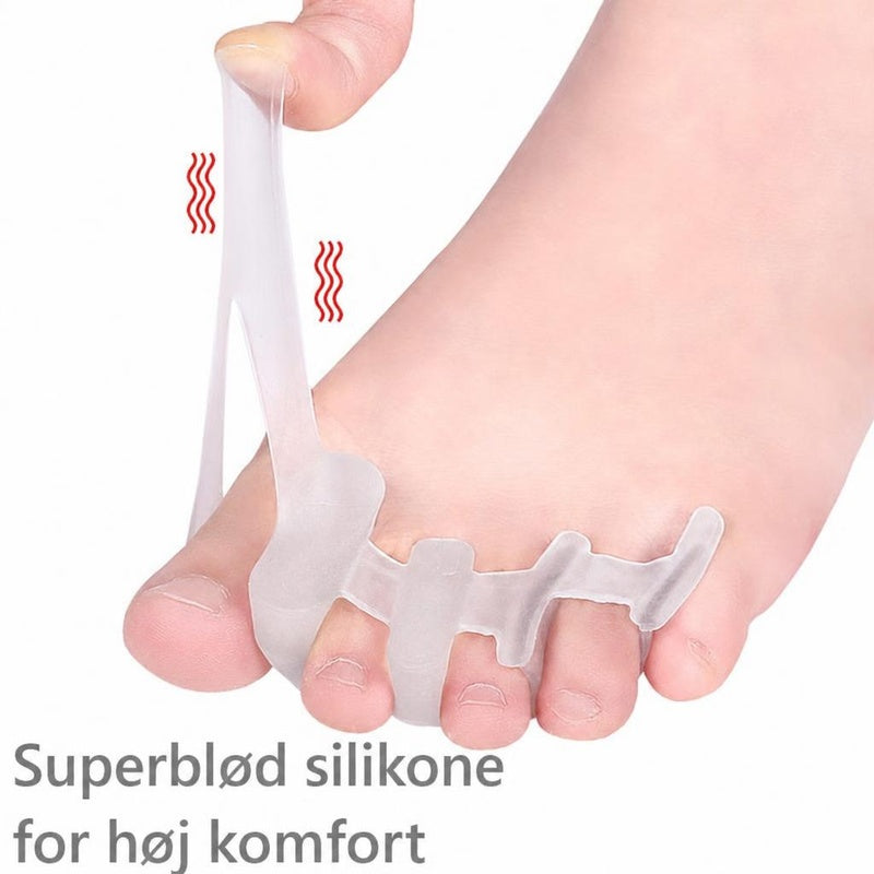 Gennemsigtig silikone tåseparator på fod, strækkes mellem storetå og hånd