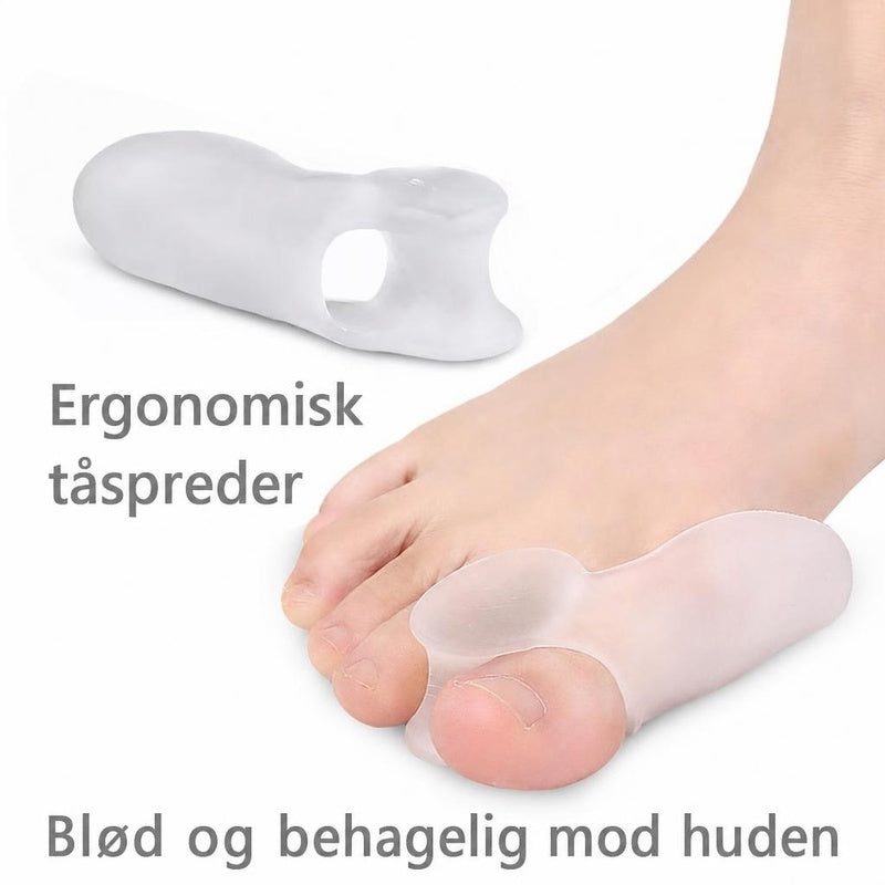 Gennemsigtig silikone tåspreder med beskyttelse omkring storetåen på en fod