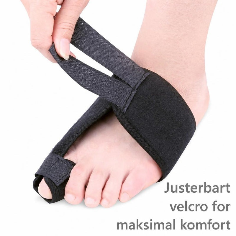 Sort hallux valgus-støtteskinne i tekstil med justerbar velcrostrop på fod