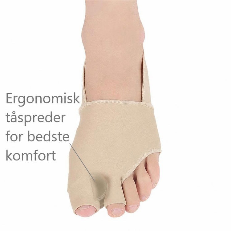 Beige stortåstøtte med tåseparator i blød tekstil på fod