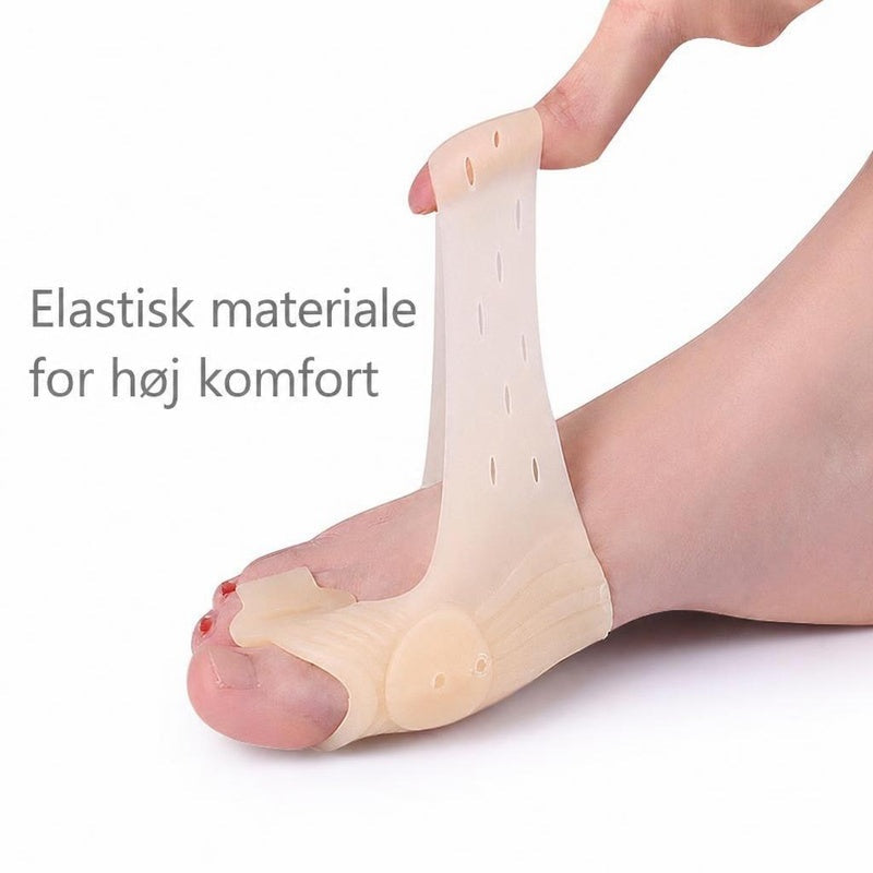 Beige elastisk stortåstøtte med tåseparator på fod, strakt op med finger