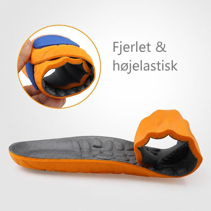 Orange og sort skumindlægssål bøjet for at vise fleksibilitet