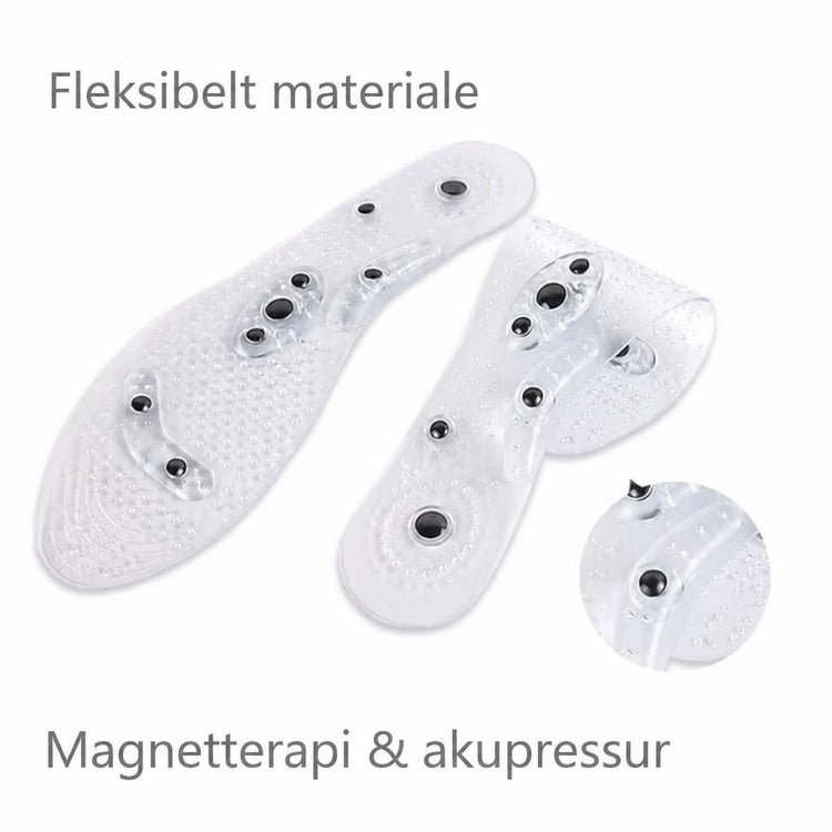 Gennemsigtige skoinlæg med massageknopper og sorte magneter på hvid baggrund