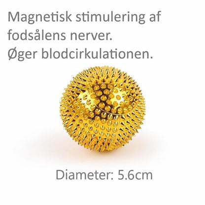 Guld massagebold med pigge og angivet diameter på 5,6 cm