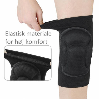 Sort juniorknæbeskytter med polstret knæpude i elastisk materiale