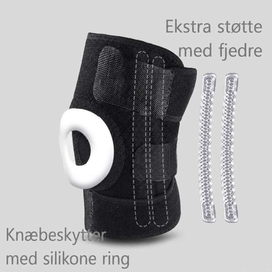 Sort knæstøtte med hvid silikonering og synlige fjedre ved siden af