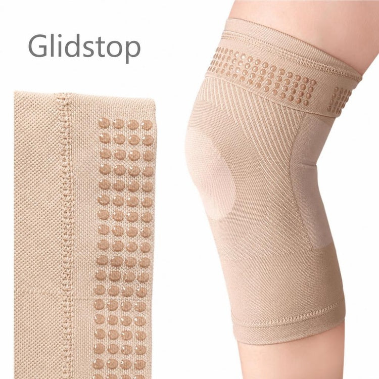 Beige elastisk knæstøtte med glidstopper og silikonedupper på indersiden