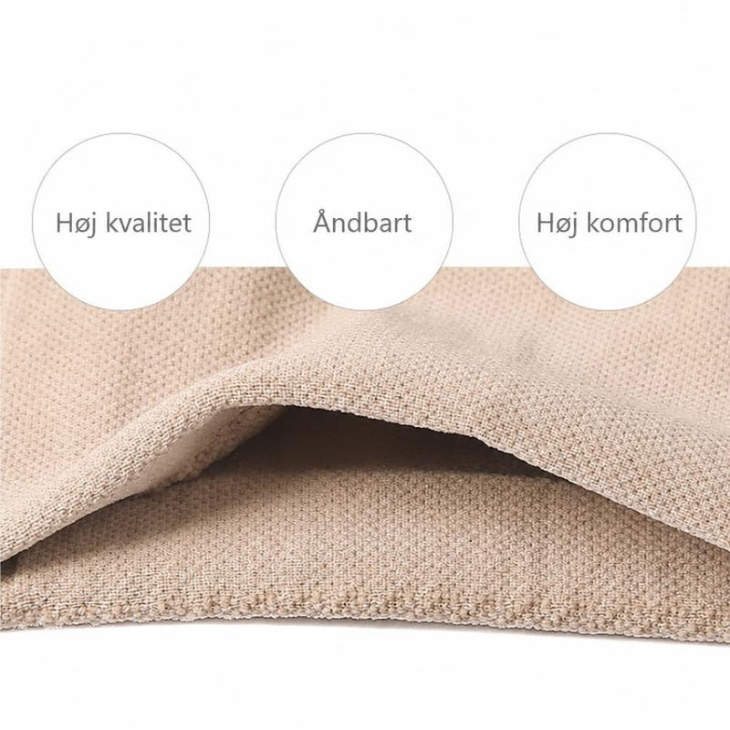 Beige elastisk knæstøtte i nærbillede med synlig stofstruktur