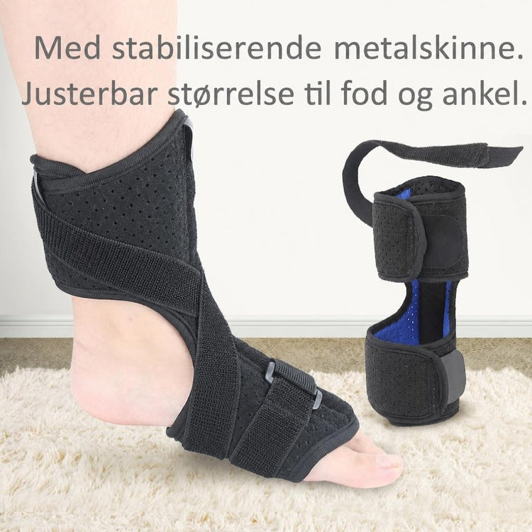 Sort dropfodsskinne med ankel- og fodremme på en fod