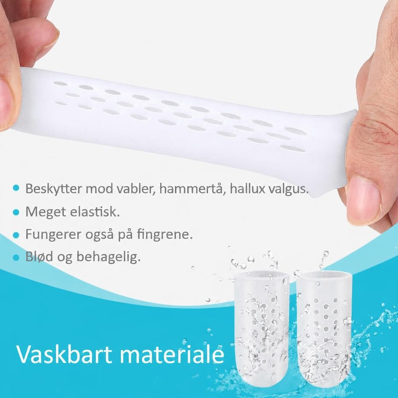 Hvid ventileret tåbeskytter i silikone strækkes mellem fingre
