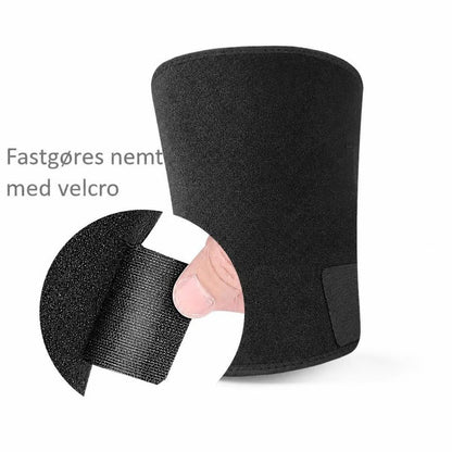 Sort justerbar lårstøtte med velcrolukning og detalje af remmen
