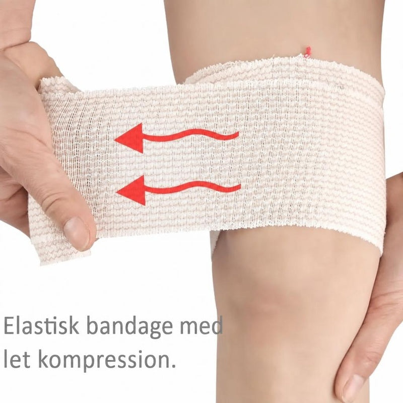 Elastisk støttebind vikles om benet med røde pile for kompression