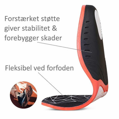 Sort og rødt sportsindlæg bøjet for at vise fleksibel forfod