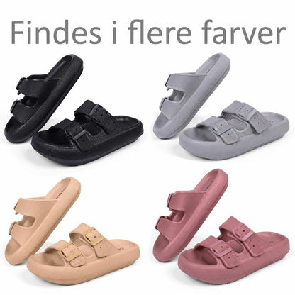 Justerbare cloud-tøfler i sort, grå, beige og rosa med spænder