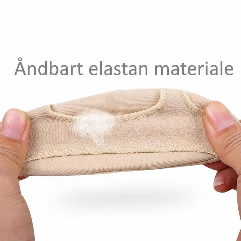 Beige framfodsindlæg i elastisk stof strækkes mellem to hænder