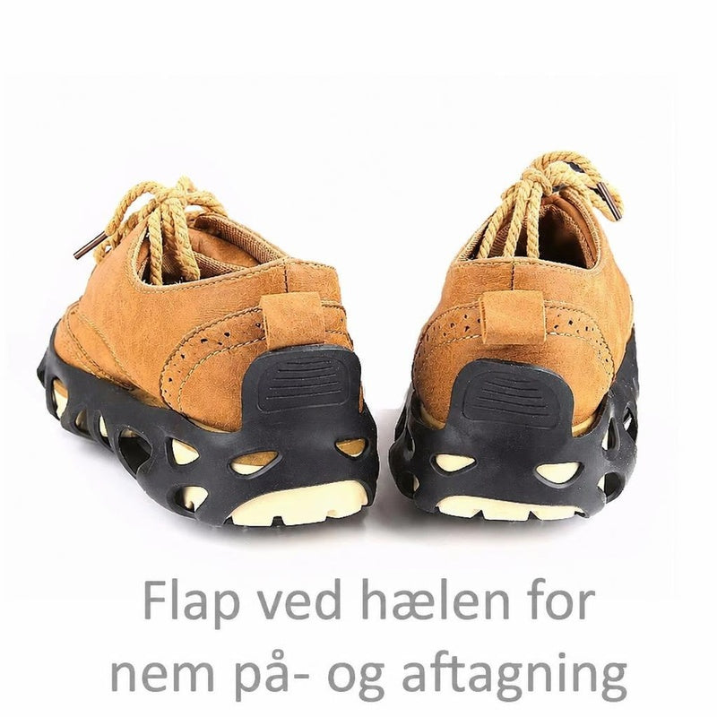 Brune sko med sorte brodder og hælflap monteret på sålen