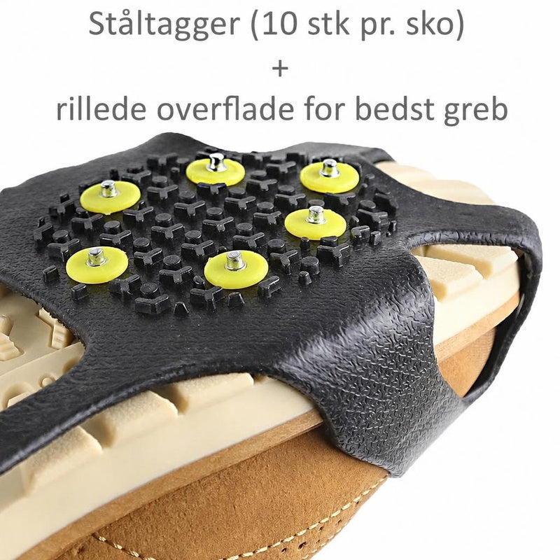 Sort halkbeskytter med gule stålpigge monteret på en skosål