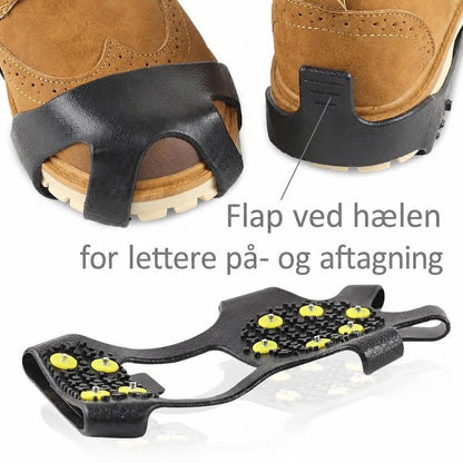 Sorte brodder med hælflap og gule pigge på støvler