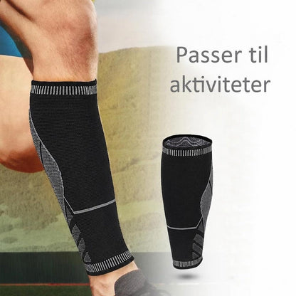 Sort støttestrømpe til læg med grå detaljer under aktivitet