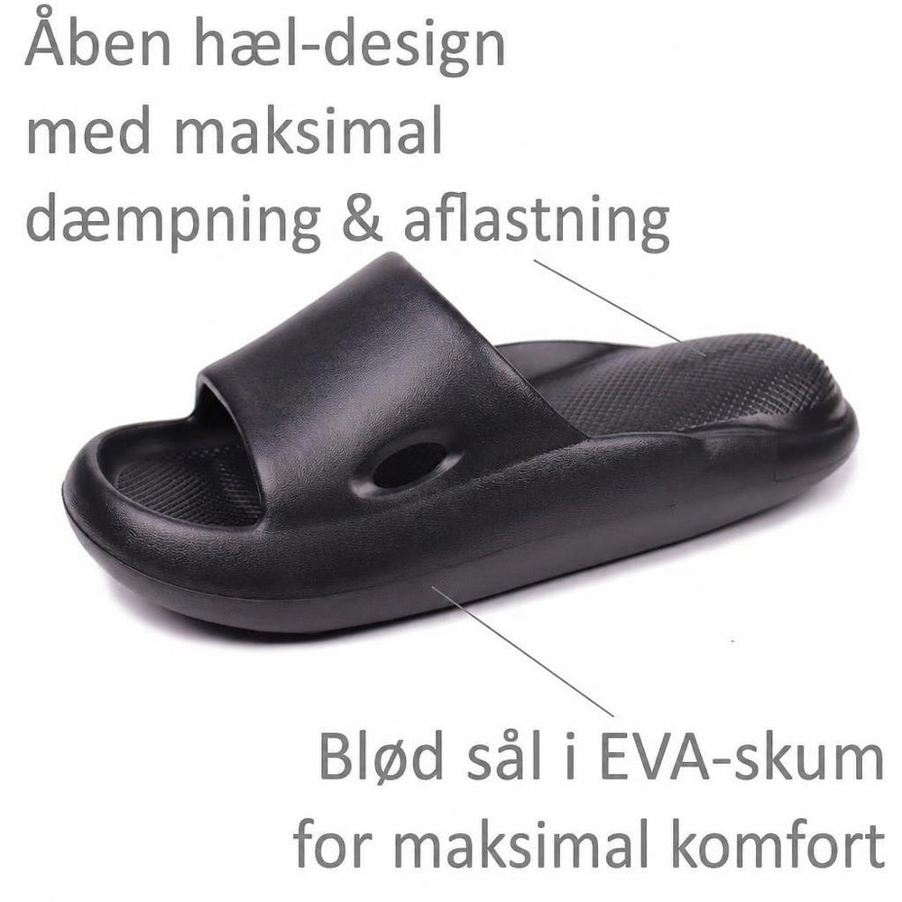Sort Bounce-badesandal med åben hæl, bred rem og tekstureret fodseng