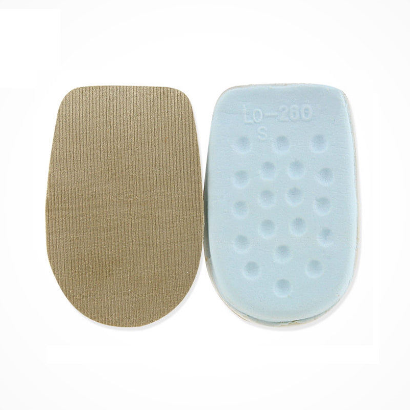 To hælindlæg i beige latexskum med tekstiloverflade og blå underside