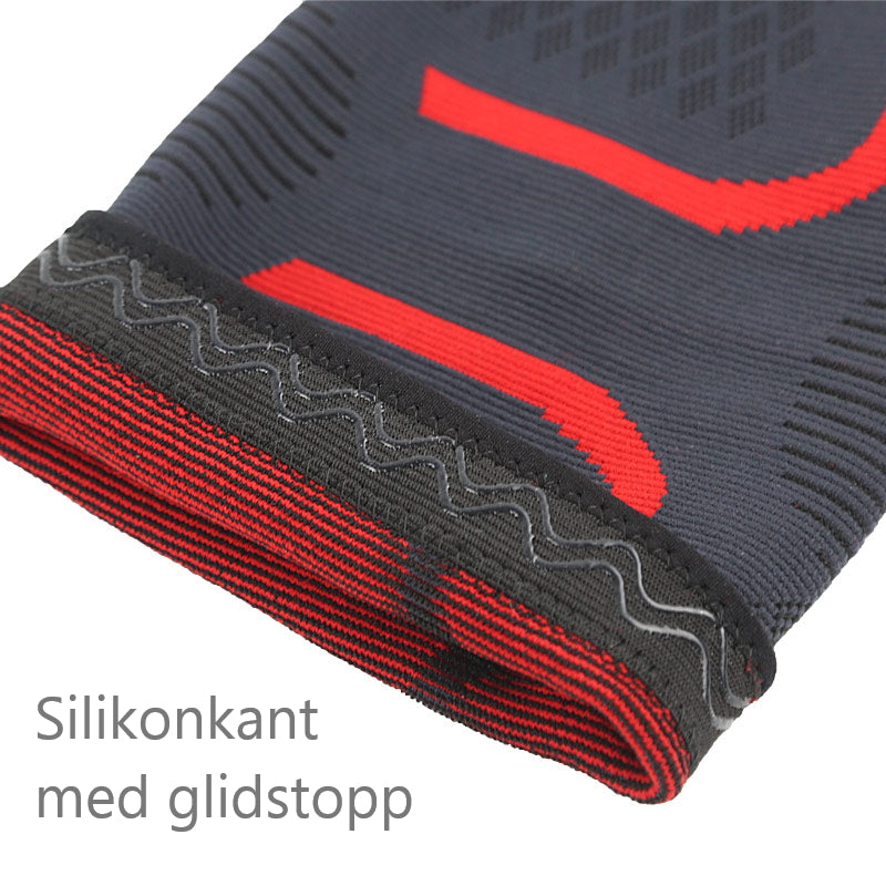 Grå og rød kompressionsknæstøtte med silikonekant og skridsikkert mønster