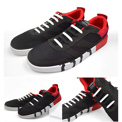Sorte sneakers med hvide elastiske silikone snørebånd og røde detaljer